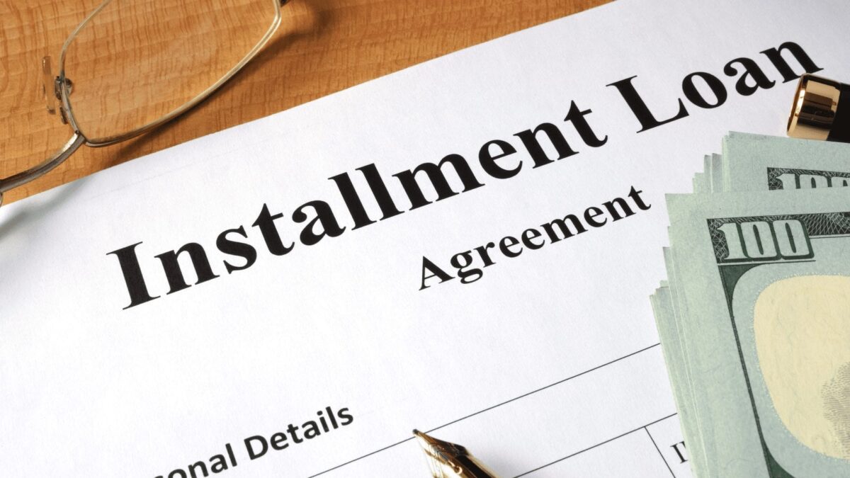 installment loan agreement form on wooden table