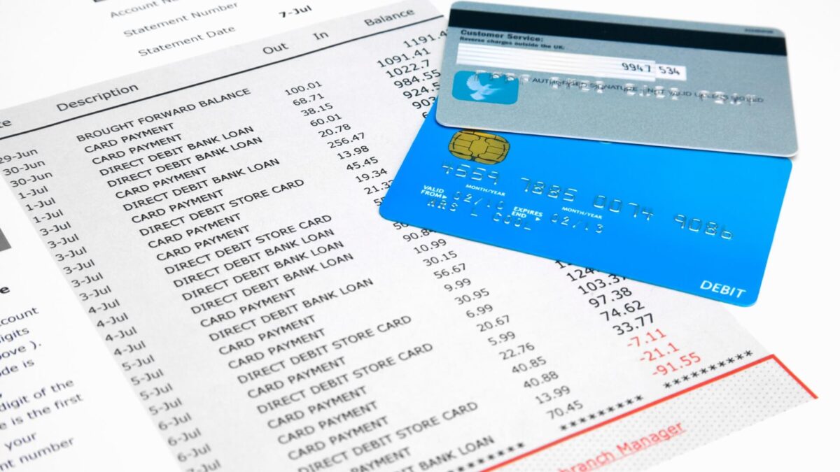credit cards sit on top of bank statements
