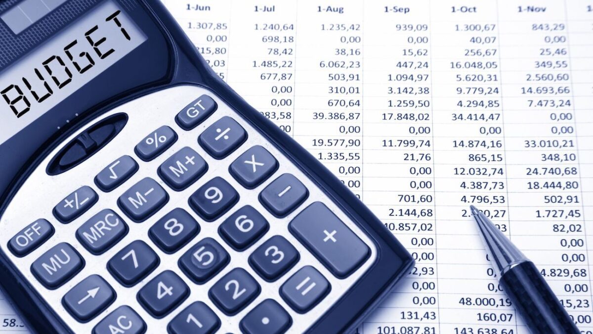 Screen of calculator spells "Budget" on top of spreadsheet data | Wise Loan