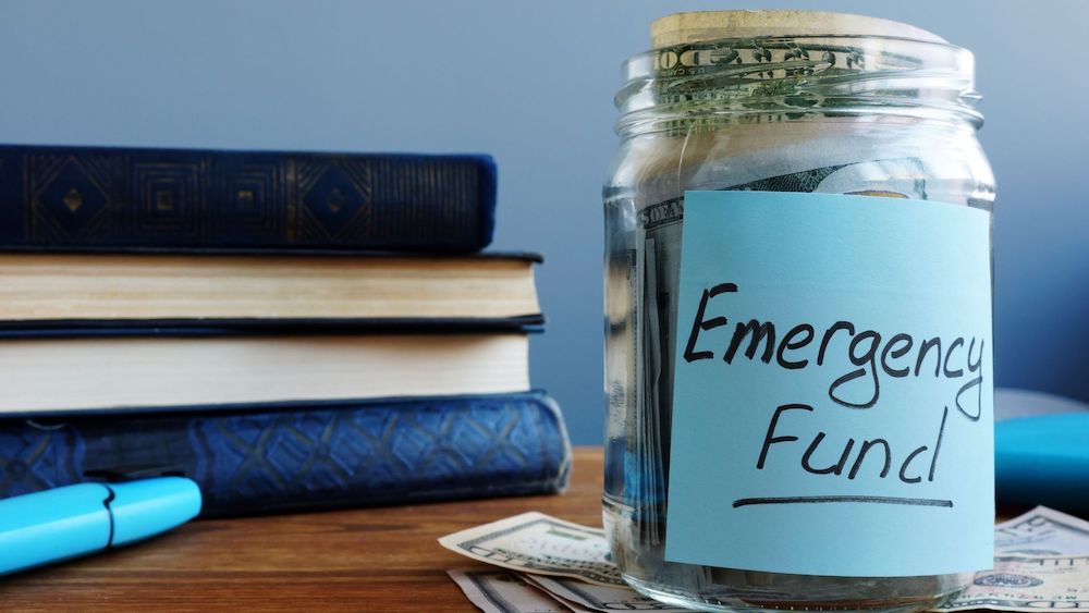Jar full of money, labeled as emergency fund | Can Inflation Impact Your Existing Personal Loans? | Wise Loan