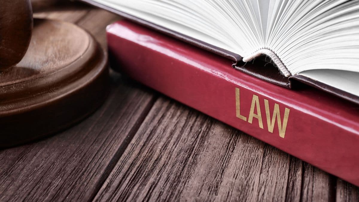 Open law textbook next to gavel | Wise Loan