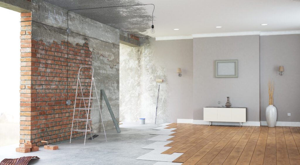 Walls being painted gray in a living room | Emergency reasons to borrow money
