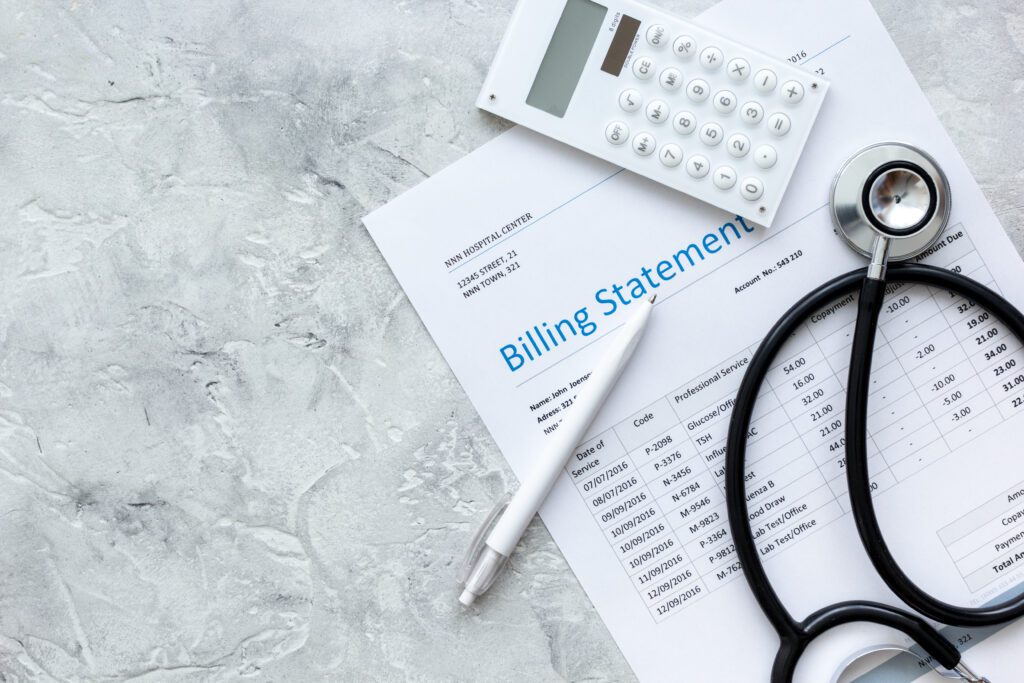 A white pen on top of a medical billing statement | Emergency reasons to borrow money