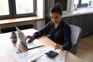 A lady reviewing different rates from lenders | Best personal loans
