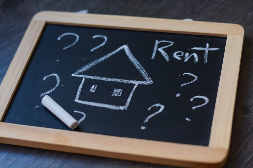 Chalkboard displaying the word, “rent” | Loan to pay rent