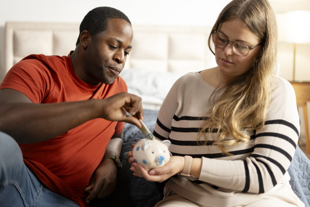 Young couple saving money for emergency