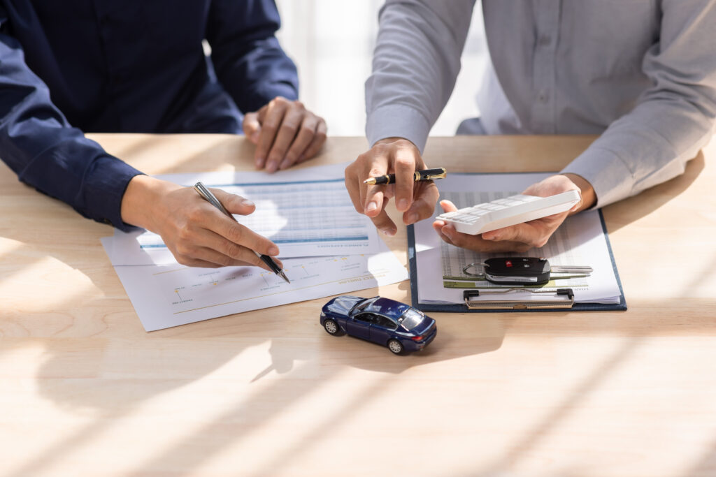 Two people talking about a loan agreement for car