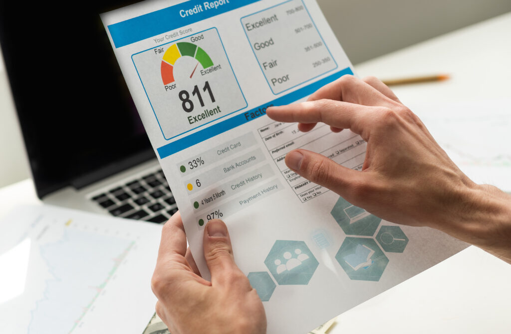 A person analyzing credit score performance on a laptop. | Can a loan build credit